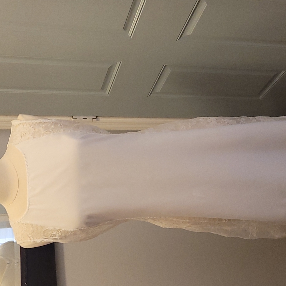 Gorgeous white long dress with lace down the sides.